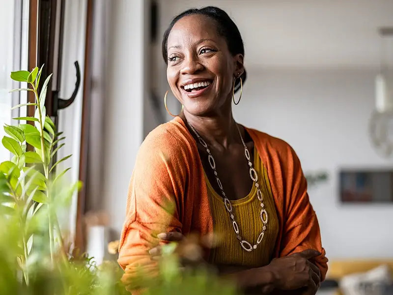 African American woman looking over her right shoulder smiling